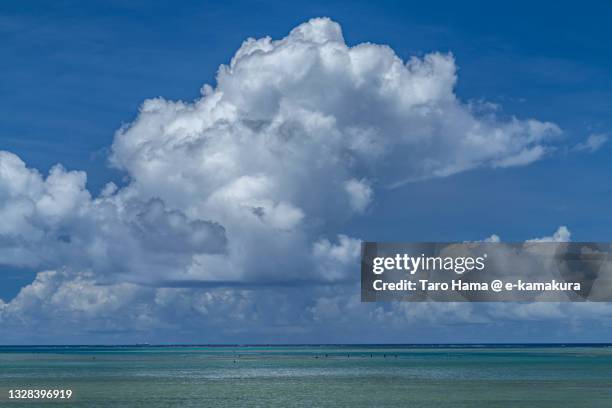 summer clouds over the beach in okinawa of japan - coral sea stock-fotos und bilder