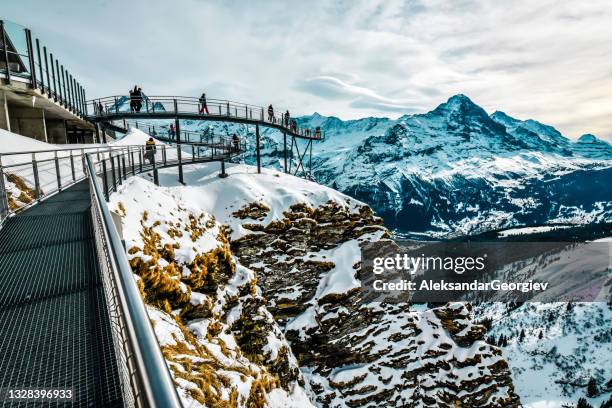 people standing on cliff walk, the famous walkway of grindelwald first, switzerland - jungfraujoch stock pictures, royalty-free photos & images