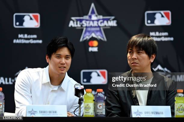 Shohei Ohtani of the Los Angeles Angels speaks to the media during the Gatorade All-Star Workout Day at Coors Field on July 12, 2021 in Denver,...