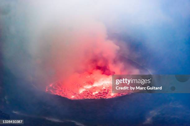 huge lava lake inside in the crater of mount nyiragongo, virunga national park, democratic republic of congo - virunga stock pictures, royalty-free photos & images