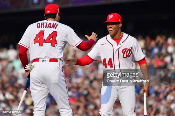Juan Soto of the Washington Nationals greets Shohei Ohtani of the Los Angeles Angels before the start of the 2021 T-Mobile Home Run Derby at Coors...