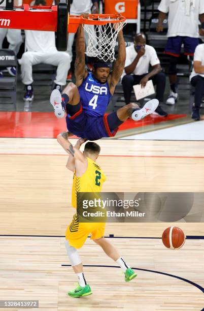Bradley Beal of the United States dunks against Nathan Sobey of the Australia Boomers during an exhibition game at Michelob Ultra Arena ahead of the...