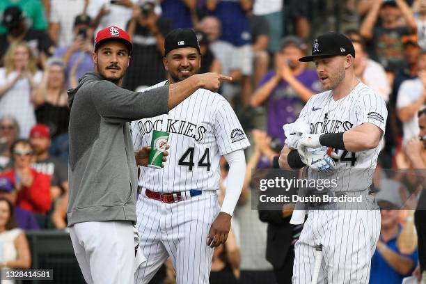 Nolan Arenado of the St. Louis Cardinals points to Trevor Story of the Colorado Rockies during the 2021 T-Mobile Home Run Derby at Coors Field on...