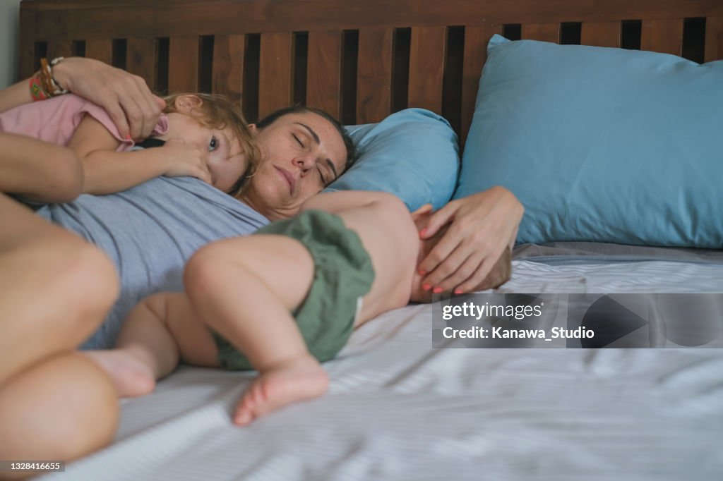 Tired Mom Sleeping With Her Kids