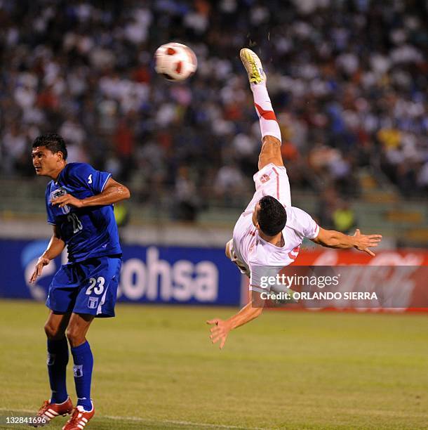 Ljajic Adem of Serbia kicks vies for the ball with Edder Delgado of Honduras during a friendly soccer match in San Pedro Sula, Honduras, on November...