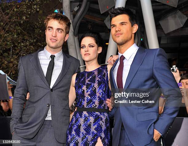 Actors Robert Pattinson, Kristen Stewart and Taylor Lautner arrive at the Los Angeles premiere of "The Twilight Saga: Breaking Dawn Part 1" held at...