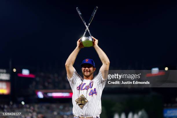 Pete Alonso of the New York Mets celebrates with the trophy after winning the 2021 T-Mobile Home Run Derby at Coors Field on July 12, 2021 in Denver,...