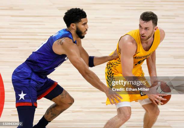 Nick Kay of the Australia Boomers is guarded by Jayson Tatum of the United States during an exhibition game at Michelob Ultra Arena ahead of the...