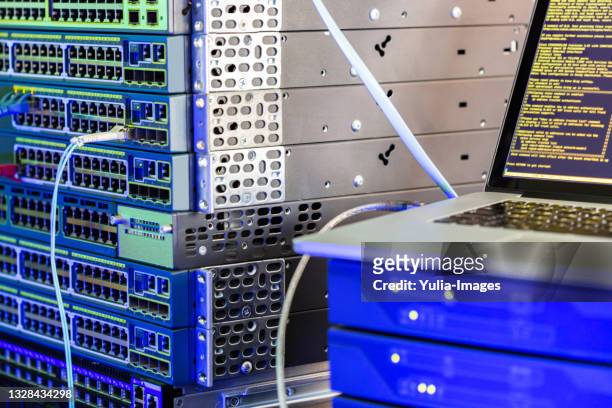 server racks in a data center with communications cables - television host stock pictures, royalty-free photos & images