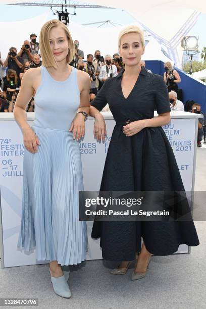 Yulia Peresild and Chulpan Khamatova attend the "Petrov's Flu" photocall during the 74th annual Cannes Film Festival on July 13, 2021 in Cannes,...