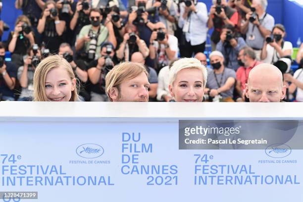 Yulia Peresild, Ivan Dorn, Chulpan Khamatova and Yury Kolokolnikov attend the "Petrov's Flu" photocall during the 74th annual Cannes Film Festival on...