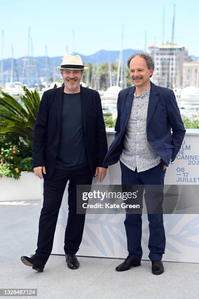 Arnaud Desplechin and Denis Podalydes attend the "Tromperie" photocall during the 74th annual Cannes Film Festival on July 13, 2021 in Cannes, France.