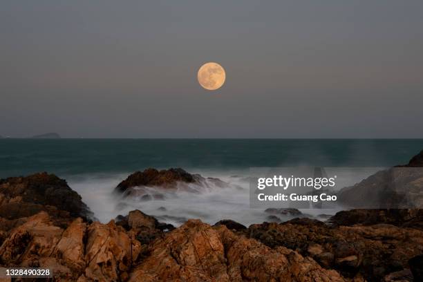 the full moon at cape d'aguilar, hong kong on october 31, 2020 - full moon stock pictures, royalty-free photos & images