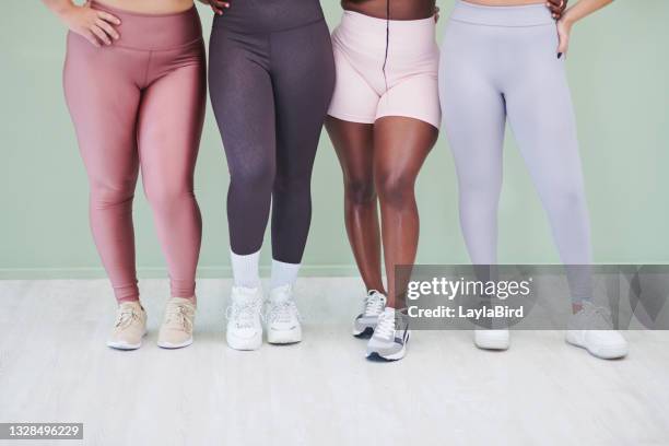 cropped studio shot of a group of unrecognizable women standing together against a green background - fat legs stock pictures, royalty-free photos & images