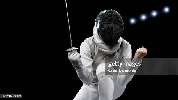 female fencing athlete celebrating victory . - fechten stock pictures, royalty-free photos & images