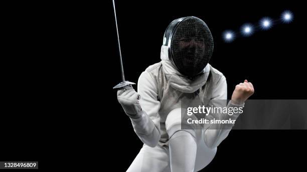 female fencing athlete celebrating victory . - face guard sport 個照片及圖片檔