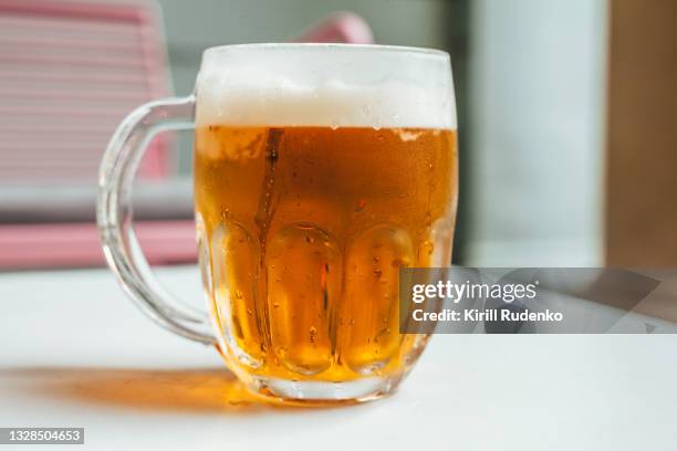 lager beer in a glass - lager stock pictures, royalty-free photos & images