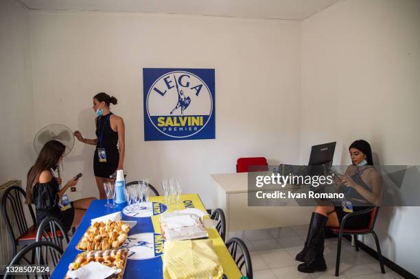 Promoter girls attend the inauguration of a party headquarters while collecting the signing of the referendum for justice reform on July 13, 2021 in...