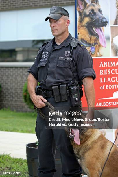 Framingham, MA. Mass State Police K9 officer Lt. Erik Ramsland and his dog Vlk, as the Mass. State Police and the Animal Rescue League team up inform...