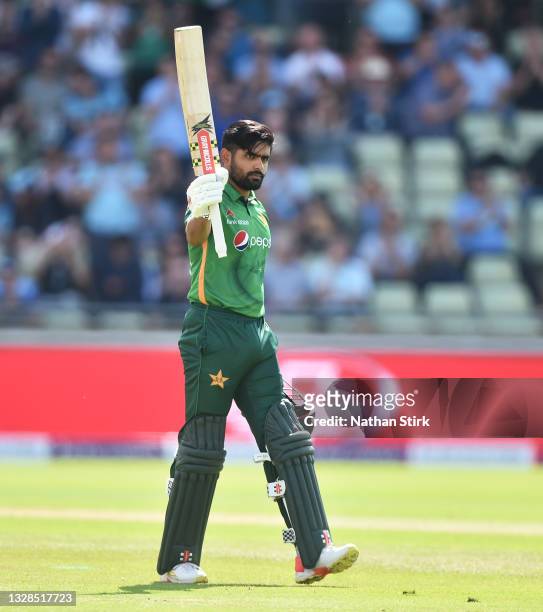 Babar Azam of Pakistan raises his bat after scoring 100 runs during the 3rd Royal London Series One Day International match between England and...