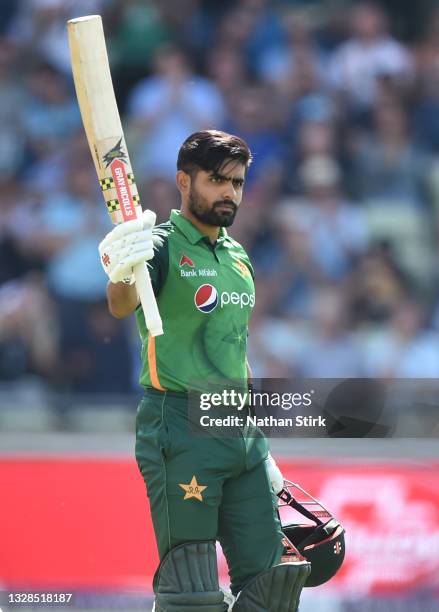 Babar Azam of Pakistan raises his bat after scoring 100 runs during the 3rd Royal London Series One Day International match between England and...