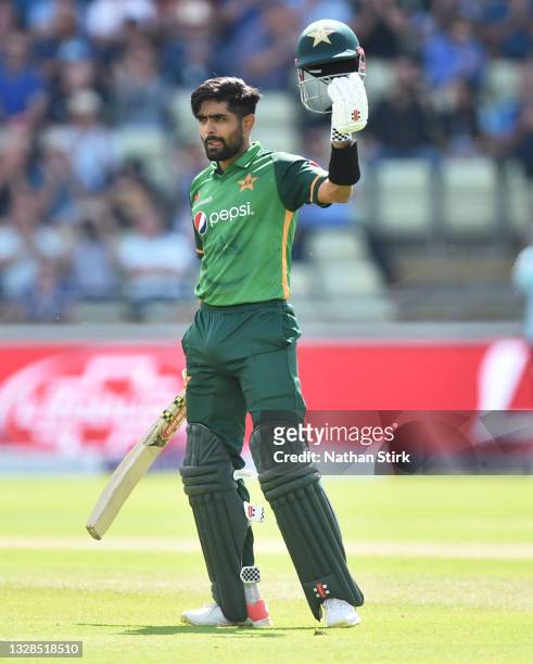 Babar Azam of Pakistan raises his helmet after scoring 100 runs during the 3rd Royal London Series One Day International match between England and...