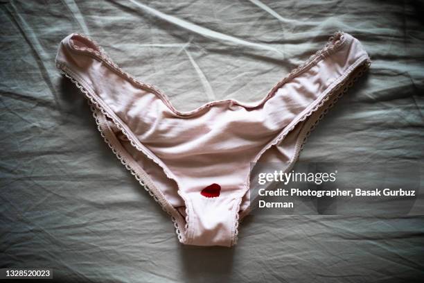 menstruation blood spot on an underwear - tanga stock-fotos und bilder