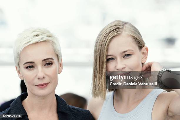 Chulpan Khamatova and Yulia Peresild attend the "Petrov's Flu" photocall during the 74th annual Cannes Film Festival on July 13, 2021 in Cannes,...