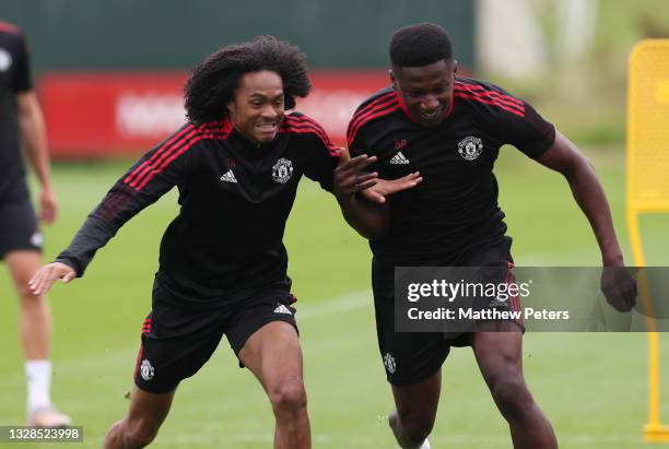 Tahith Chong and Di'shon Bernard of Manchester United in action during a first team training session at Carrington Training Ground on July 13, 2021...