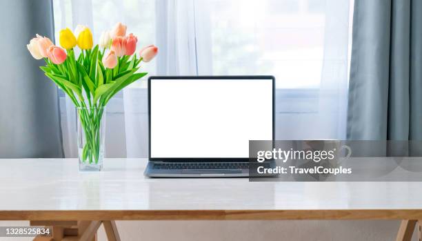 workplace with laptop on table at home. laptop with blank screen on white table. home interior or office background - laptop on desk mockup stock pictures, royalty-free photos & images