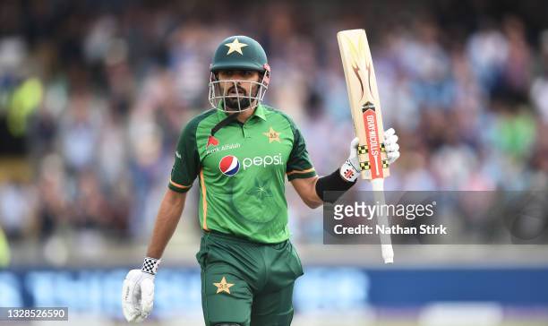 Babar Azam of Pakistan raises his bat after getting out for 158 runs during the 3rd Royal London Series One Day International match between England...