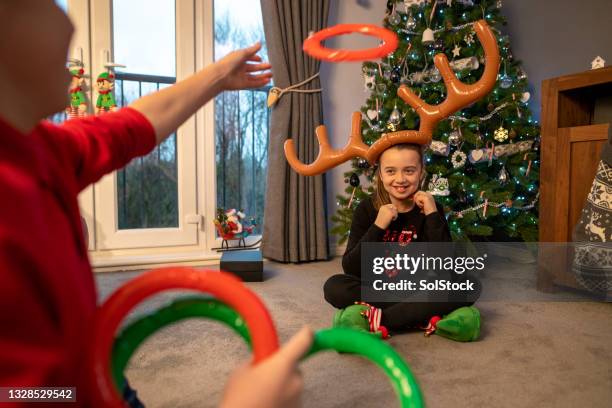 passing time before presents - costume reindeer antlers stock pictures, royalty-free photos & images