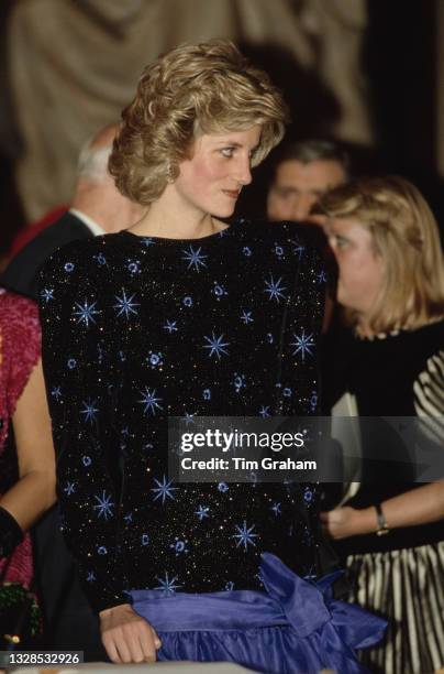 British Royal Diana, Princess of Wales , wearing a blue-and-black Jacques Azagury outfit, attends a dinner hosted by the Mayor of Florence, in...