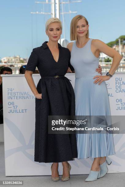 Chulpan Khamatova and Yulia Peresild attend the "Petrov's Flu" photocall during the 74th annual Cannes Film Festival on July 13, 2021 in Cannes,...