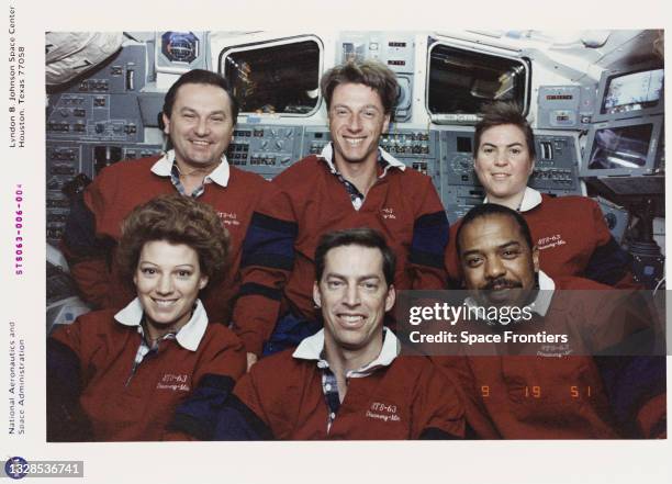 The crew of Shuttle Mission STS-63 pose for a traditional in-flight group portrait on Space Shuttle Discovery; Front row left to right: Eileen M...