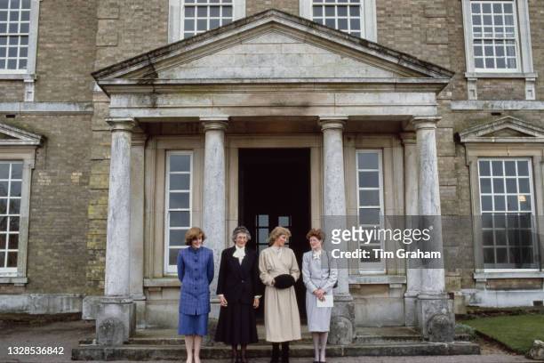 Lady Jane Fellows, Headmistress of West Heath School Ruth Rudge , British Royal Diana, Princess of Wales , wearing a full-length ivory coloured...