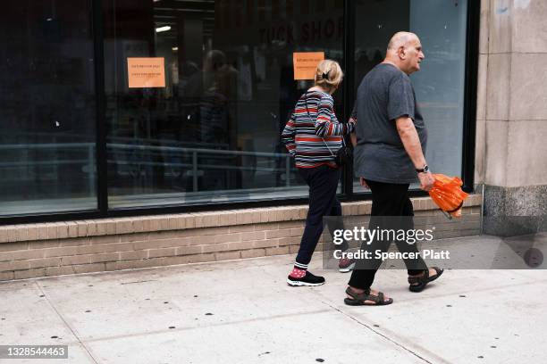 People walk by a closed Kmart store at Astor Place in New York’s East Village on July 13, 2021 in New York City. For over two decades, Kmart has been...