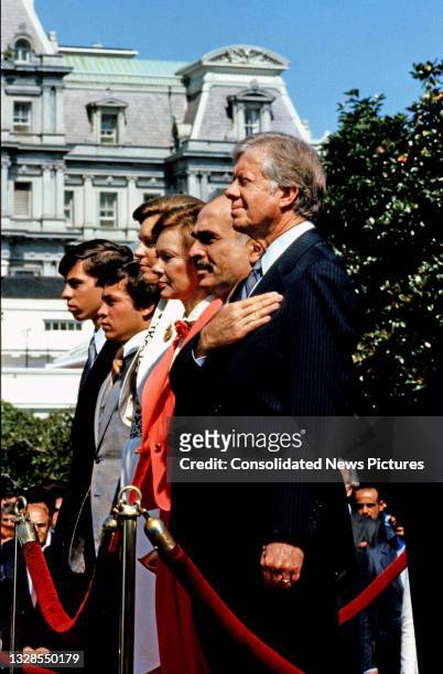 View of King Hussein I of Jordan and US President Jimmy Carter as they stand for their respective national anthems during a State Arrival ceremony on...
