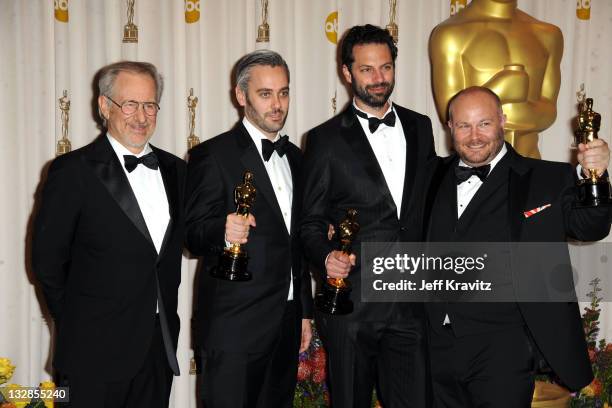 Presenter Steven Spielberg, producers Emile Sherman, Iain Canning, and Gareth Unwin pose in the press room during the 83rd Annual Academy Awards held...