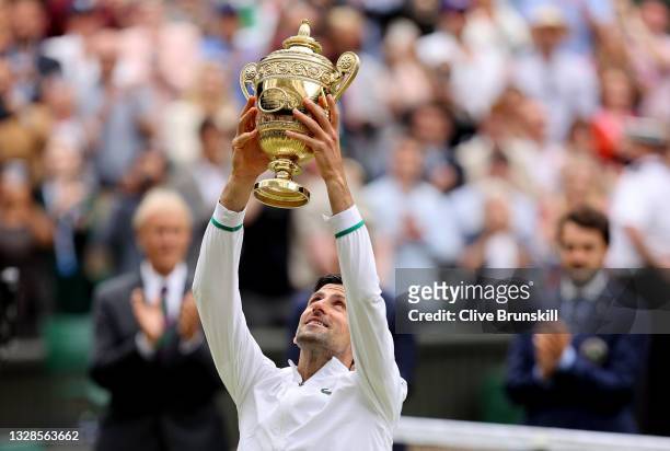 Novak Djokovic of Serbia holds the trophy aloft after winning his men's Singles Final match against Matteo Berrettini of Italy on Day Thirteen of The...