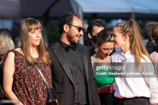Alice Winocour, Tuva Novotny and Sameh Alaa attends the "Titane" screening during the 74th annual Cannes Film Festival on July 13, 2021 in Cannes,...