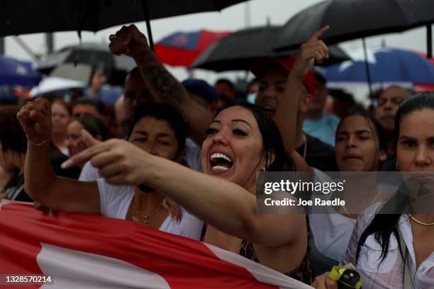 Protesters shut down part of the Palmetto Expressway as they show their support for the people in Cuba that have taken to the streets to protest on...