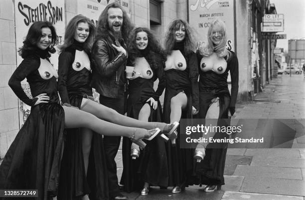 Scottish musician Ian Anderson of rock band Jethro Tull poses with dance troupe Pan's People outside the Rainbow Theatre in Finsbury Park, London,...