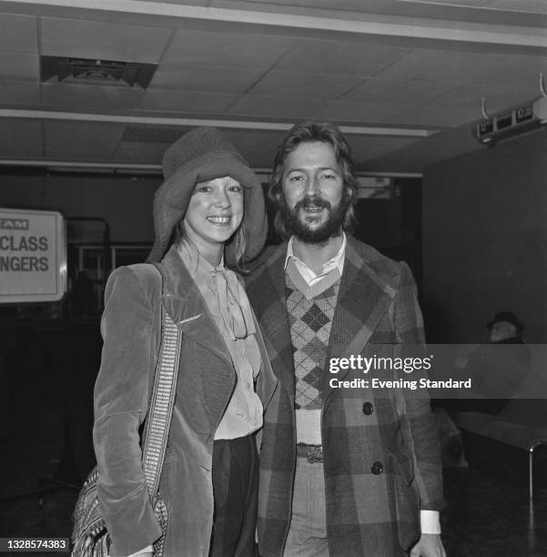 English guitarist and singer Eric Clapton with model Pattie Boyd, the wife of George Harrison of the Beatles, UK, 14th November 1974. Boyd's divorce...