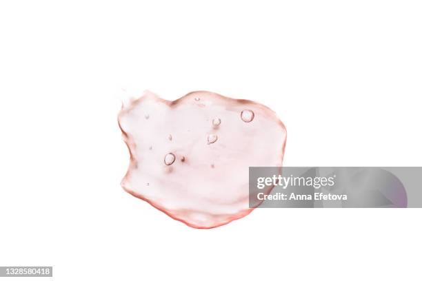 smear of pink cosmetic tonic with air bubbles on white background. flat lay style. macro - facial cleanser stockfoto's en -beelden