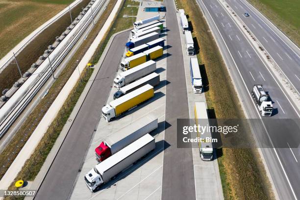 trucks in parking lot, aerial view - trucks in a row stock pictures, royalty-free photos & images