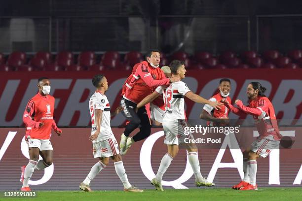 Vitor Bueno of Sao Paulo celebrates with teammates after scoring the first goal of his team during a round of sixteen match between Sao Paulo and...