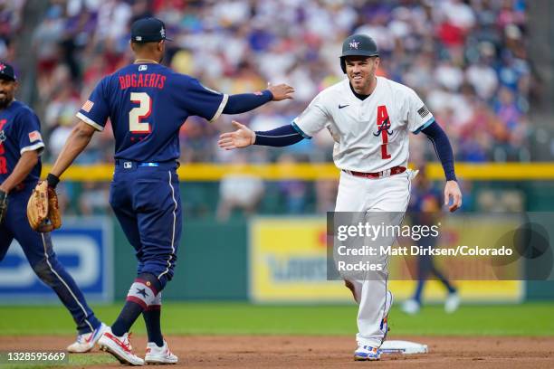 National League All-Star Freddie Freeman of the Atlanta Braves high fives American League All-Star Xander Bogaerts of the Boston Red Sox during the...