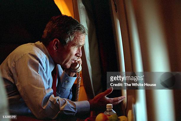 President George W. Bush speaks to Vice President Dick Cheney by phone aboard Air Force One September 11, 2001 after departing Offutt Air Force Base...