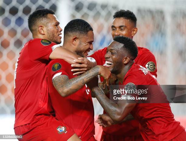 Eric Davis of Panama, center, is congratulated by his teammates as he scores on penalty kick during the second half against Qatar during a Group D...